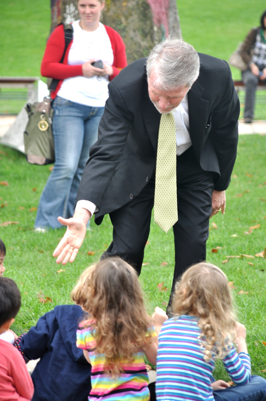 Lane shakes the hands of children at the announcement. (credit: Alan Vangpat/Layout Staff)