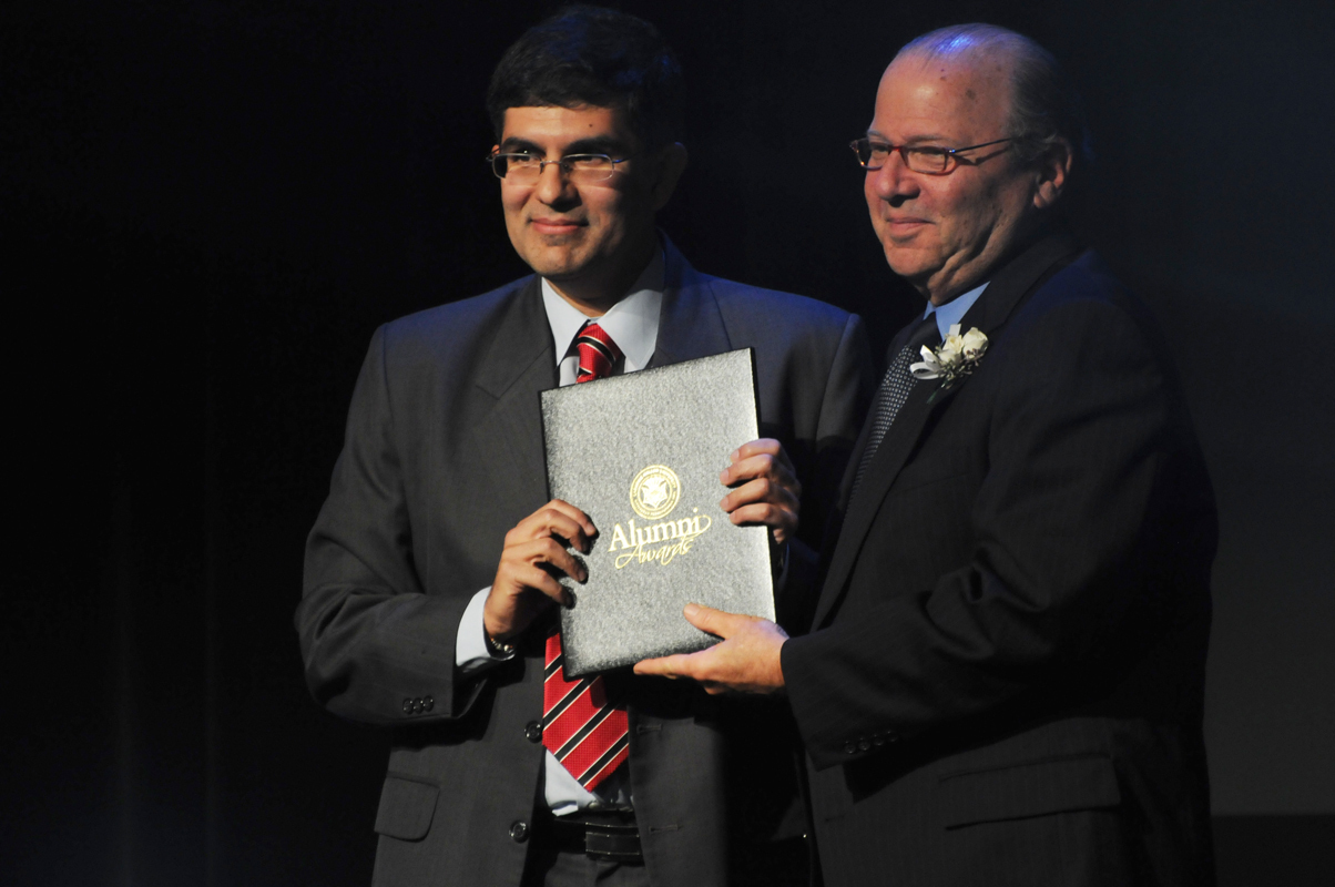 Ricoh Innovation Inc. CEO Nikhil Balram poses with University President Jared Cohon after receiving an Alumni Achievement Award for his work in video-processing algorithms. Balram’s algorithms power televisions, projectors, displays, and disc players. (credit: Thomas Hofman/Photo Editor)