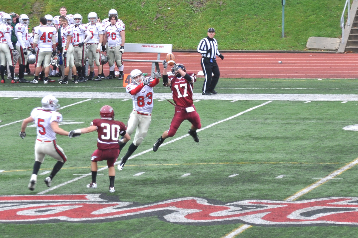 Junior cornerback Sam Thompson (No. 17) pulls down one of his two interceptions on a Dan Burkett pass to senior wide receiver Austin Morman. (credit: Alan Vangpat/ Senior Staff)
