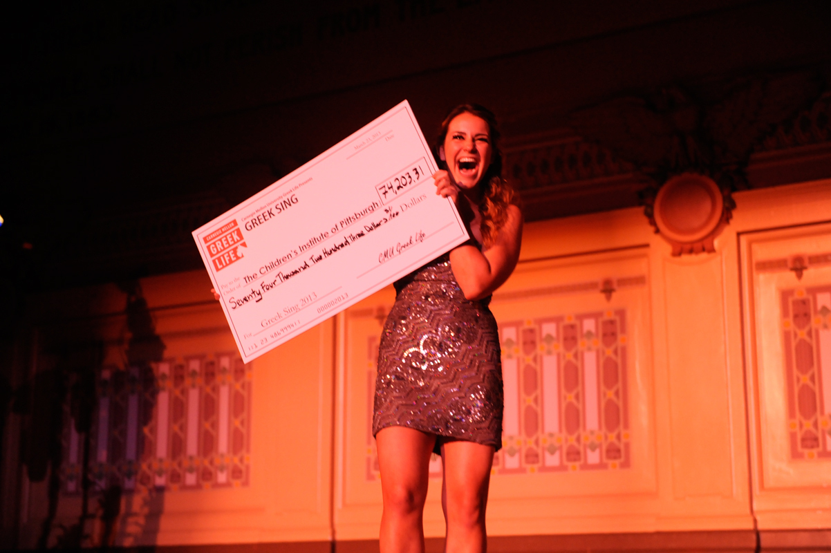 Greek Sing Overall Chair and emcee Molly Shanley excitedly announced the $74,203.31 total that Greek organizations raised for the Children's Institute of Pittsburgh this year. (credit: Alex Webster/)