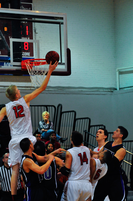 Junior Seth Cordts assists first-year Jack Serbin for two points. (credit: Jason Chen/)