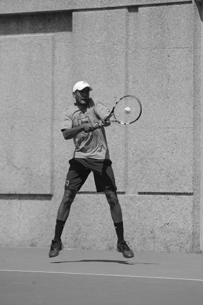 Abhishek Alla connects with a forehand swing against Johns Hopkins. (credit: CMU Athletics)