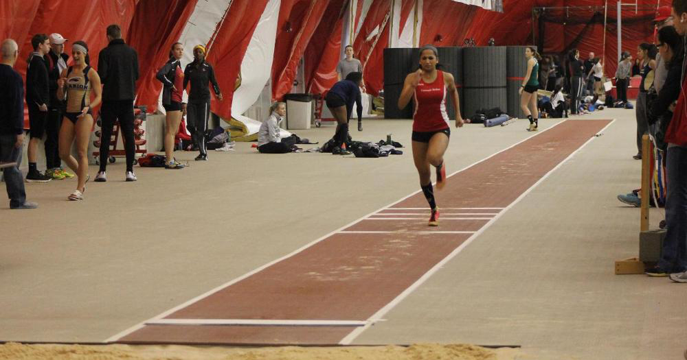 Sprinter and jumper Debarati Bhanja sprints to the jump line during the UAA indoor championships at NYU. (credit: Courtesy of CMU Athletics)