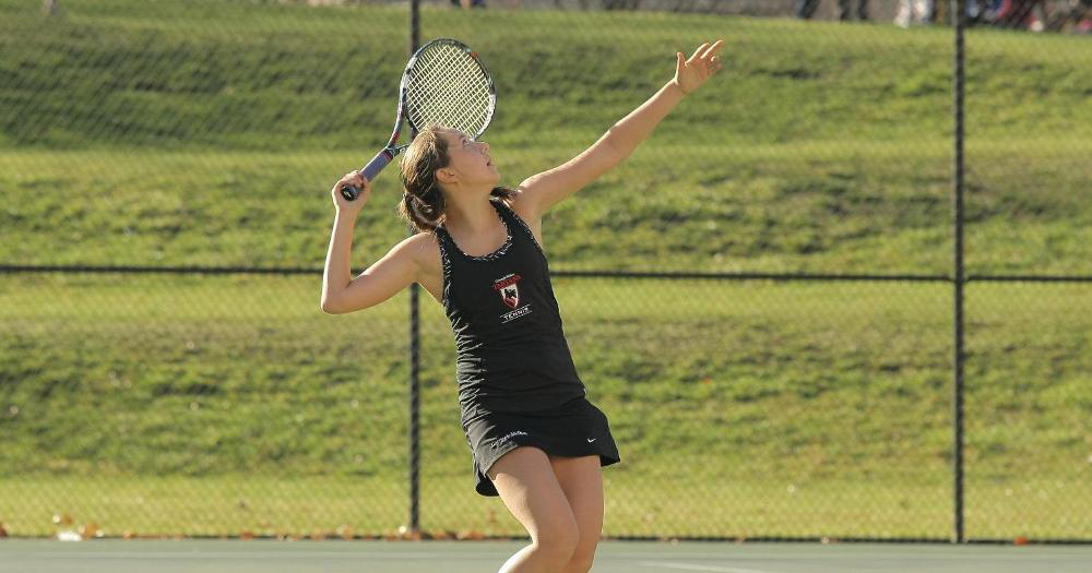 First-year jamie Vizelman winds up in preparation to serve her opponent the ball during a tennis competition. (credit: Courtesy of CMU Athletics)