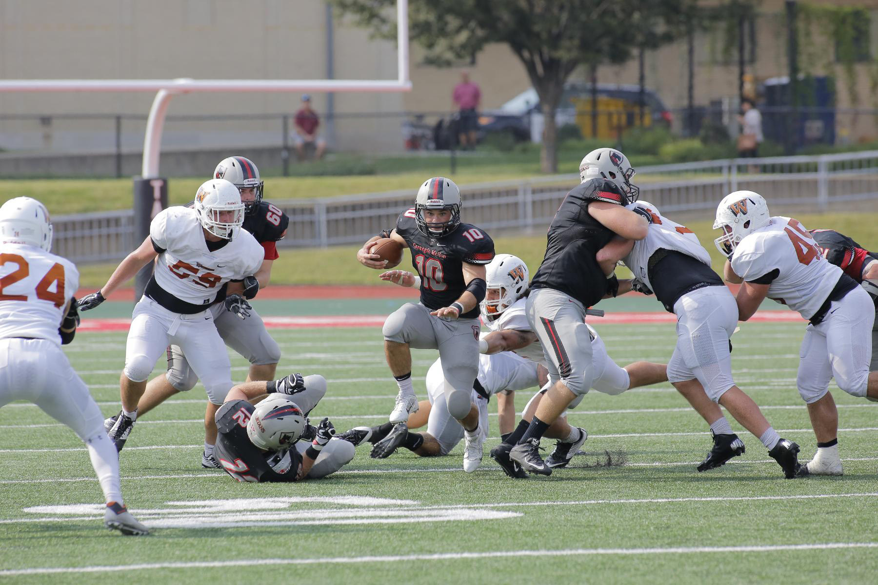 Junior running back Sam Benger bursts through the defense of Waynesburg in the Tartans' victory on Saturday. (credit: Courtesy of CMU Athletics)