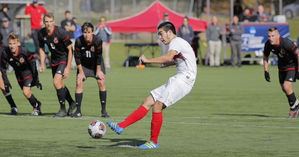 Junior midfielder Jimmy Jameson looks down field as he makes a quick pass to a teammate across the field. (credit: Courtesy of CMU Athletics)