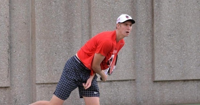 First-year Mike Prettyman hard at work in a doubles rally. Prettyman has emerged as a new tennis threat. (credit: CMU Athletics)