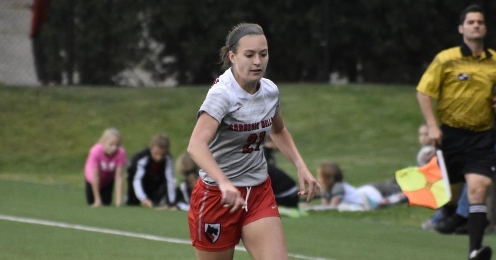 Junior defender Emily Tolmer takes the ball away from the Tartans’ side of the field to set up an offensive shot. (credit: Courtesy of CMU Athletics)