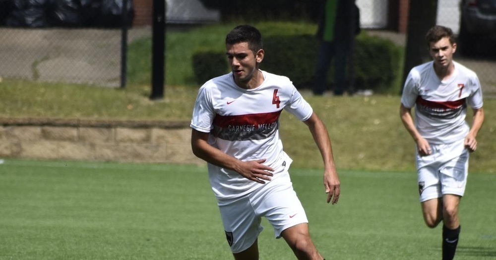 A midfielder hurries to the ball. (credit: Courtesy of CMU Athletics)