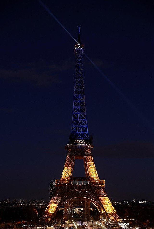 In Paris, home of the Stade de France, the Eiffel Tower was lit in solidarity. (credit: Courtesy of Raphael Krawzyk/Andalou Agency via Wikimedia Commons)