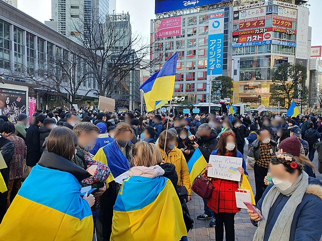 Protestors in Japan took to the streets, gathering in Hachiko square in Shibuya, Tokyo, with signs, flags, etc. (credit: Courtesy of Syced via Wikimedia Commons)